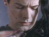 Ohhh, I got something on my shirt. (He's actually wrestling his pet, Squish.)